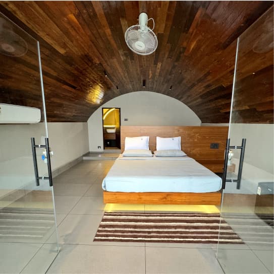 Top bedroom at Tira Beach Resort with ocean-facing windows
